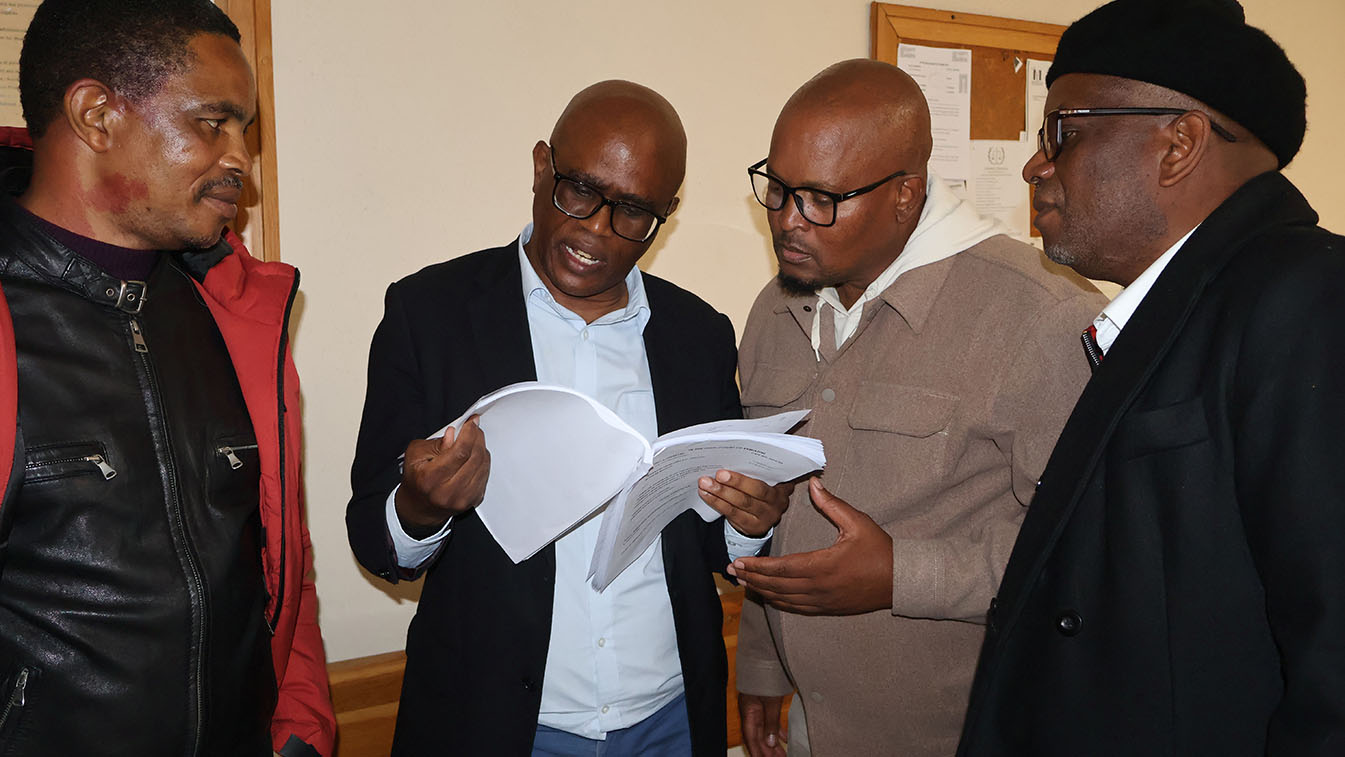 Mbabane Swallows FC faction quickly browsing through court documents in a case involving (Pty) Ltd. (Below) Swallows supporters reacting during a game. (File pics)